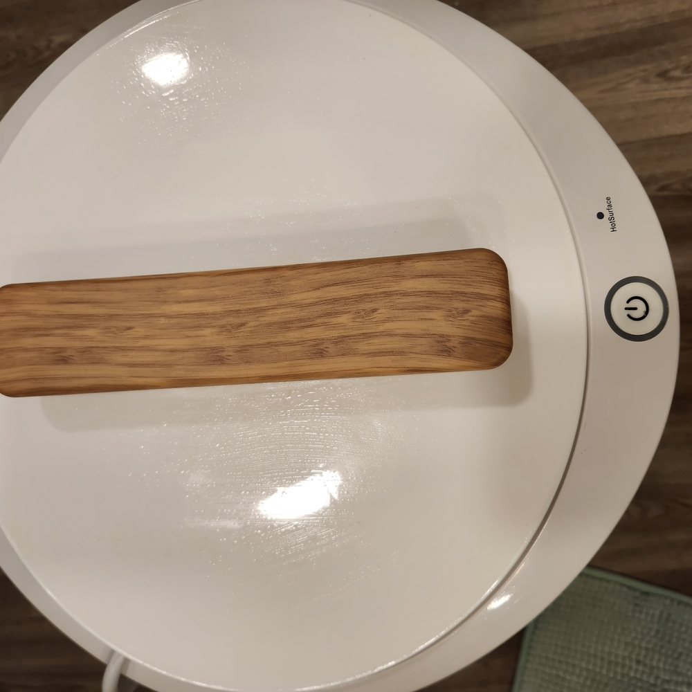 Modern White and Brown Circular Appliance with Wooden Grip